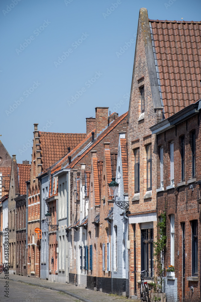 Fototapeta premium Old medieval houses in narrow streets in central Bruges, Flanders, Belgium, tourists destination in Europe