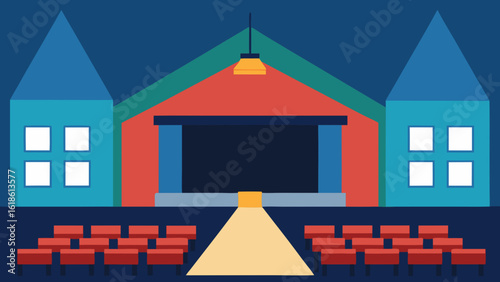 Large Empty Auditorium at a School with a Single Light on the Stage