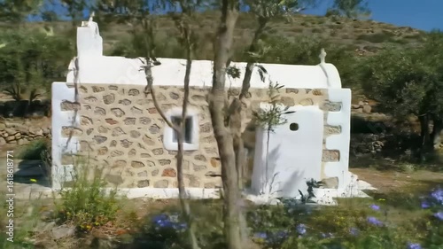 Small stone chapel in a hillside meadow