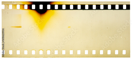 35 mm filmstrip with analog film burn effect, film noise texture and background, old film frame from analog retro film roll, photo texture with grain and scratches for vintage effect with damaged film