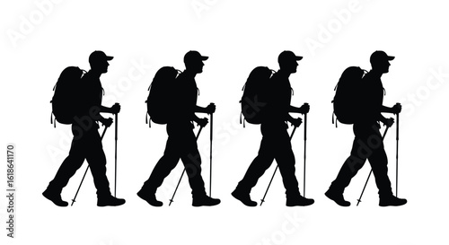 Four hikers with backpacks and trekking poles walking in a line side view silhouette