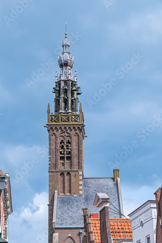 Beautiful Leaning Carillon Tower (De Speeltoren) of the old Church of Our Lady, tilting over Kleine Kerkstraat. The tower was constructed in the 15th and 16th centuries. EDAM, NETHERLANDS.