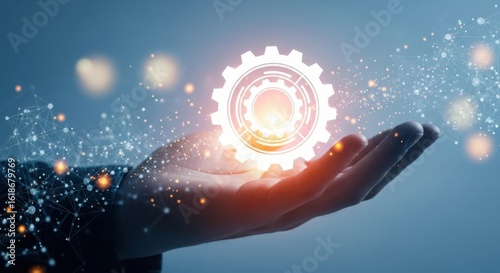 A glowing gear hovers above a hand, representing technological innovation and future progress