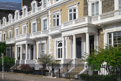 Long row of yellow brick townhouses in central London