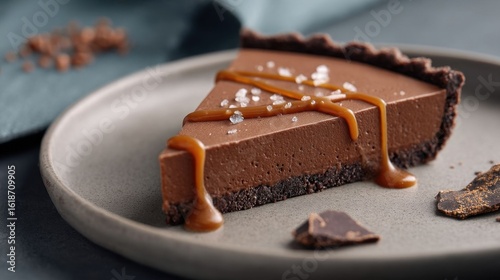Slice of chocolate tart with caramel.