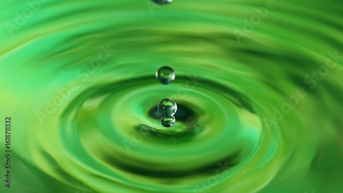 Green Water drop falling, m...