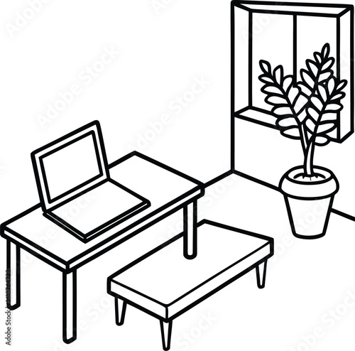dorm with small table plant and open laptop