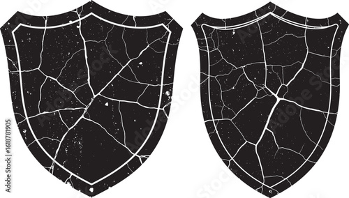 Two cracked black shields silhouette