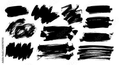 Black paint brush strokes in varying shapes and sizes  