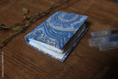 Small blue journal with handmade sheets