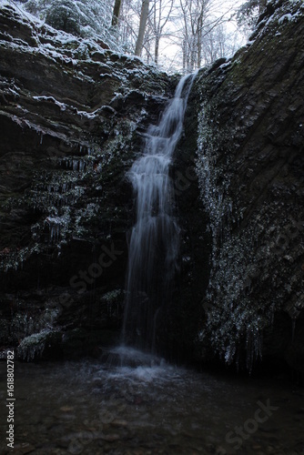 waterfall in the winter forest, dark vibe