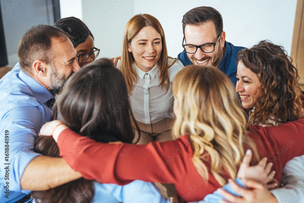 Obraz premium Diverse Team Embracing in a Circle to Show Support and Collaboration