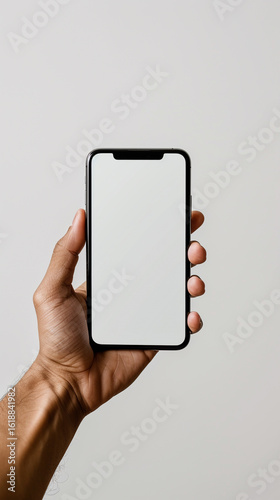 Male hand holding a smartphone with a white screen on a white background