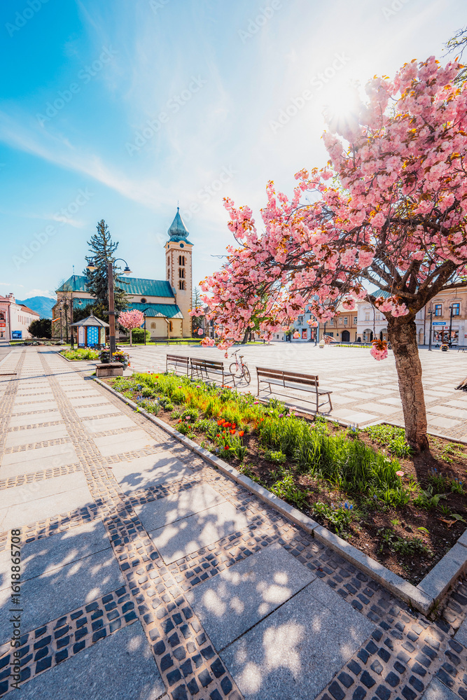 Naklejka premium Liptovsky Mikulas main square in Liptov region around Tatras mountains , Slovakia. Church sv. Mikulasa