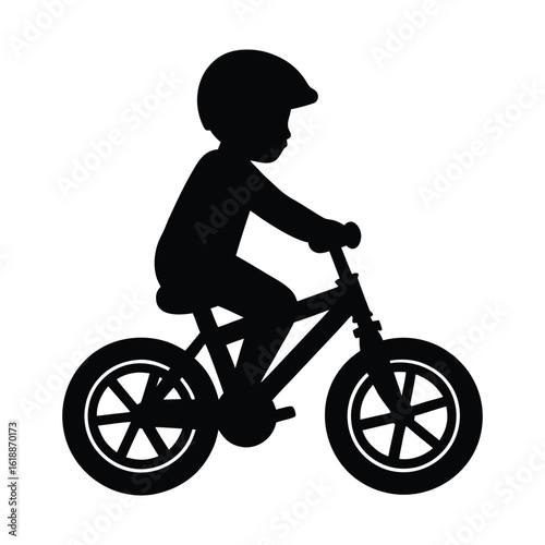 silhouette of a boy on a bicycle