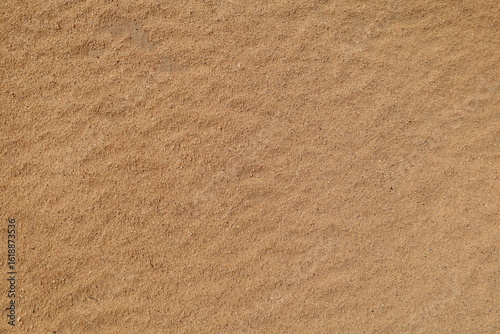 Fototapeta Naklejka Na Ścianę i Meble -  sand texture - background of desert sand dunes. Beautiful structures of sandy dunes. sand with wave from wind in desert - Close up