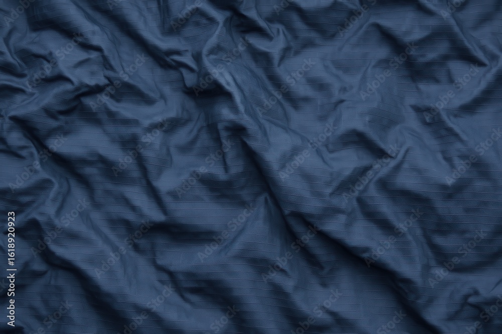 Fototapeta premium Wrinkled Navy Ripstop Nylon under Cloudy Sky Lighting – Visible Reinforced Pattern