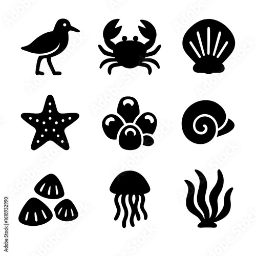 Seaside Wildlife Icons. Solid, filled icon set of seaside wildlife in splash zones: sandpiper, crab scurry, shellfish, tidepool