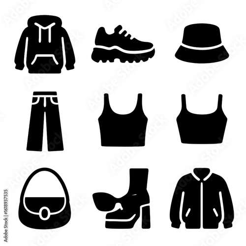 Trendy Fashion Icons. Solid, filled icon set of trendy fashion items: oversized hoodie, chunky sneakers, bucket hat, wide-leg
