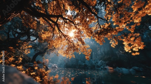 Golden leaves shimmer as sunlight filters through trees beside a tranquil lake in autumn