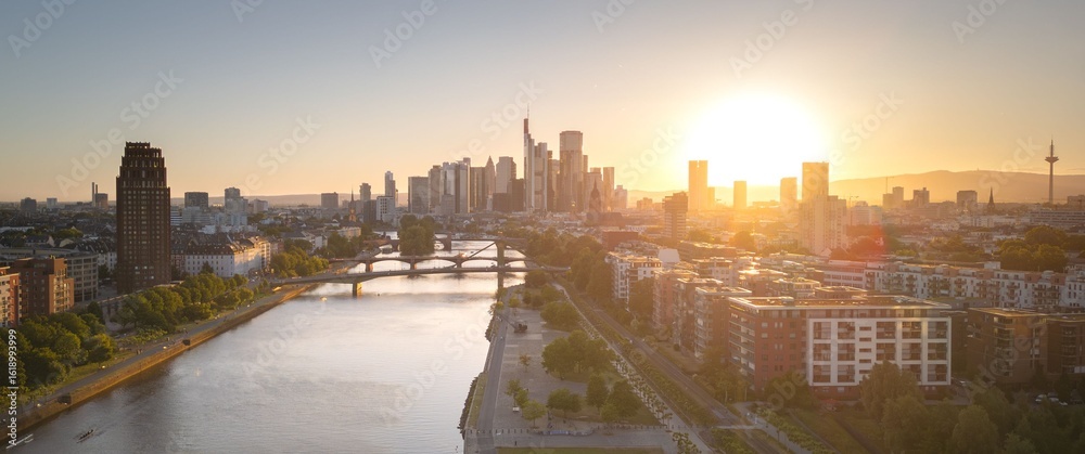 Naklejka premium Frankfurt skyline at sunset with Main River.