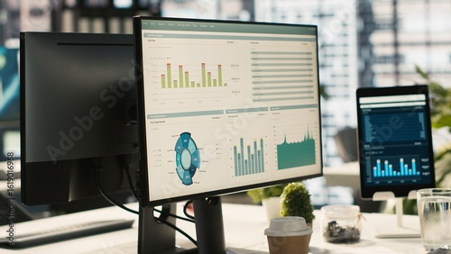 Bilde på lerret Financial charts and KPI metrics on displays in office, panning shot