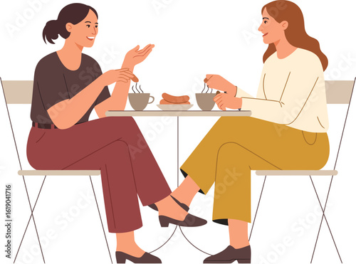 Two women engaged in a lively conversation while seated at an outdoor cafe table