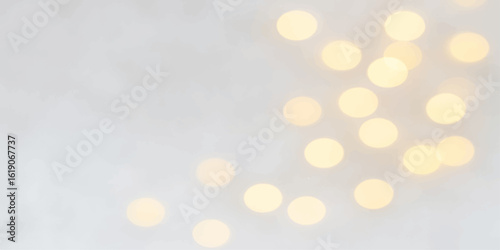 Golden, glowing bokeh lights create a festive, blurred abstract background perfect for Christmas or holiday celebrations