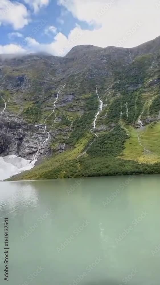 Scenic cinematic landscape of a quiet valley surrounded by lush green hills Scenic cinematic landscape of a quiet valley surrounded by lush green hills