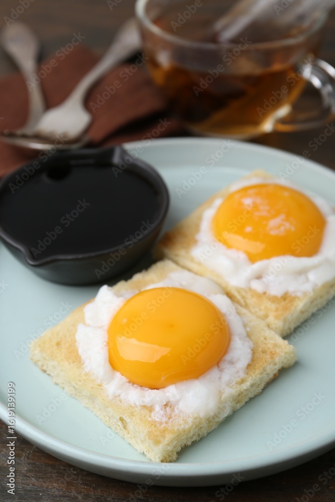 Tasty kaya toasts with half-boiled eggs served on table, closeup. Traditional asian breakfast Tasty kaya toasts with half-boiled eggs served on table, closeup. Traditional asian breakfast
