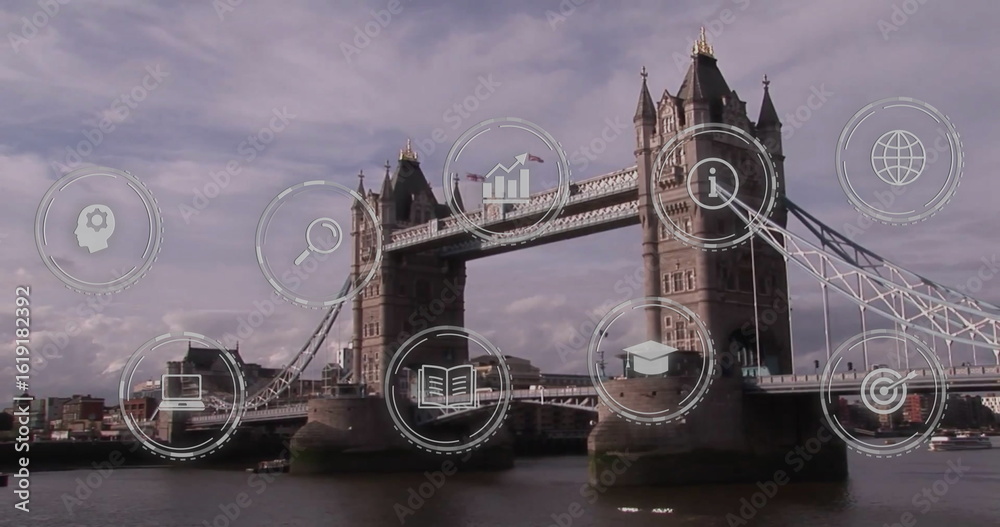 Fototapeta premium Showcasing Tower Bridge spanning River Thames at London riverside, with digital icons overlaying