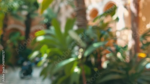 Wallpaper Mural A cheerful woman carrying multiple shopping bags. She is smiling and looking at the camera. The setting appears to be a public area with plants in the background. Torontodigital.ca