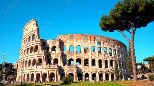 Ancient Colosseum under a vibrant blue sky