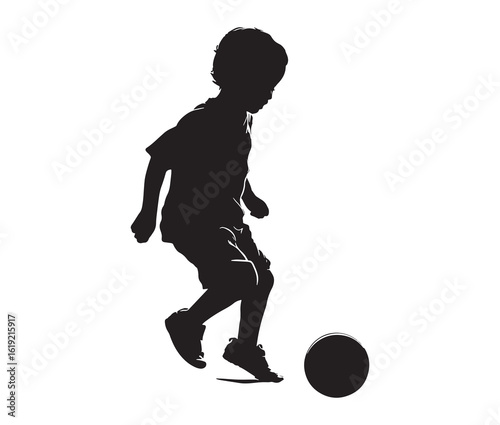 Black silhouette of a child kicking a ball.