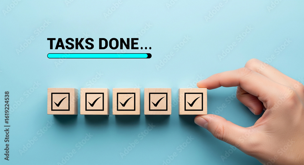 © Chan_Studio - Hand Placing Last Wooden Cube with Checkmark for Tasks done and Progress Bar on Blue Background © Chan_Studio - Hand Placing Last Wooden Cube with Checkmark for Tasks done and Progress Bar on Blue Background