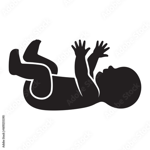 Silhouette of a happy baby lying on its back with arms and legs raised in playful exuberance