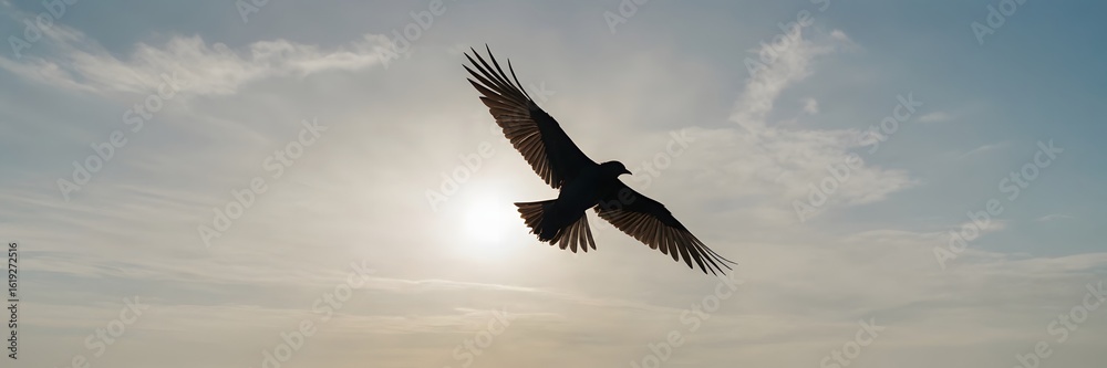 Fototapeta premium Silhouetted Bird Flying Against Bright Sun in Sky During Sunset