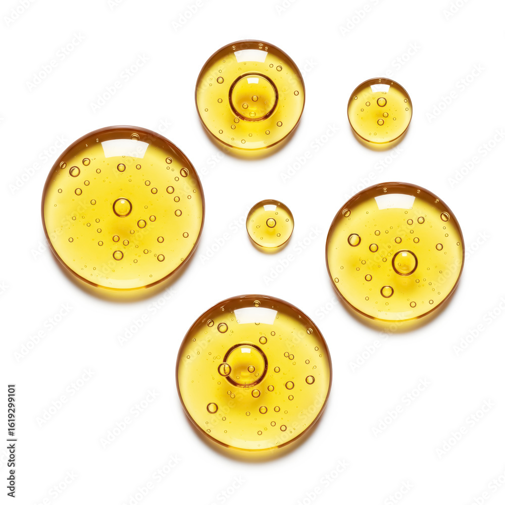 Fototapeta premium Golden yellow bubble oil or serum isolated on white background. Serum drops with air bubbles. Collagen gel, cosmetic product for skin care, lotion or essence droplets