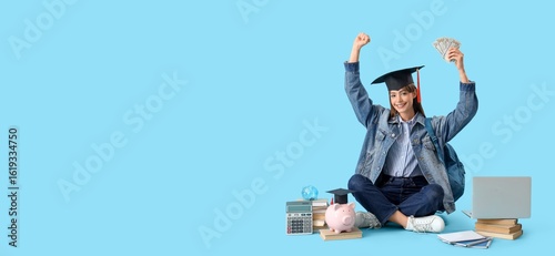 Happy female student in gra...