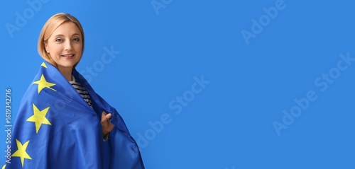 Mature woman with flag of E...