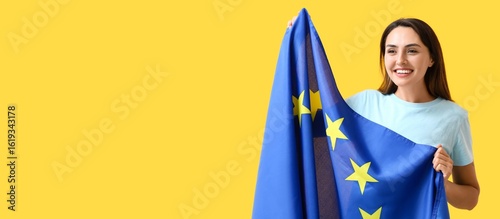 Young woman with flag of Eu...
