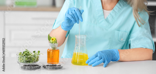 Female scientist with flask...