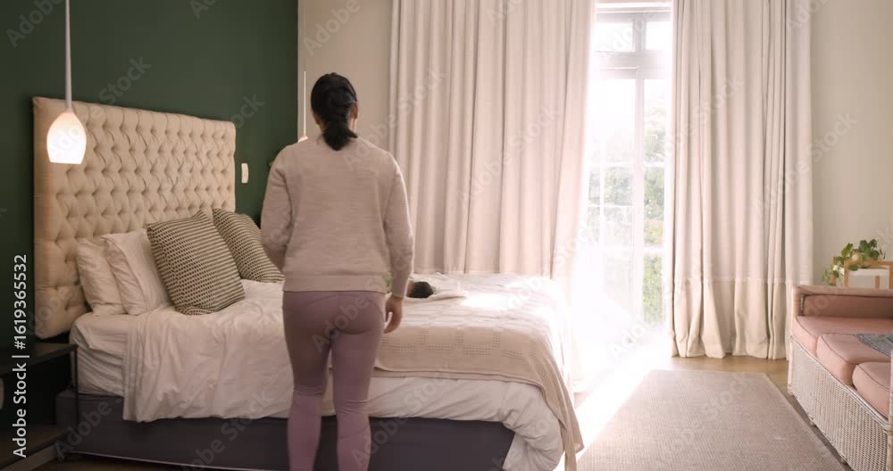 Mid-adult mother noticing infant stretching in bedroom seeking calm flowing into tree pose on mat Mid-adult mother noticing infant stretching in bedroom seeking calm flowing into tree pose on mat