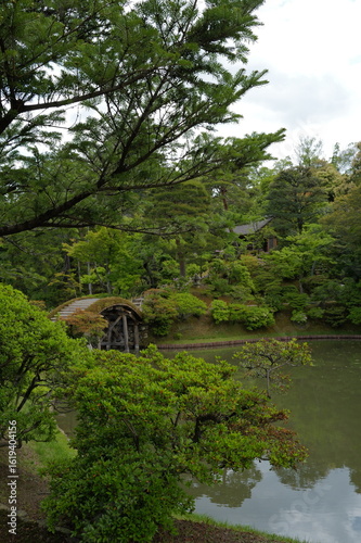 the famous royal japanese garden in kyoto with lush plants 