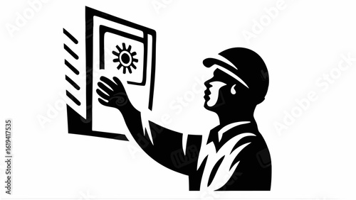 Silhouette of a worker wearing a cap reaching towards a safe with a sun symbol on it in black and white
