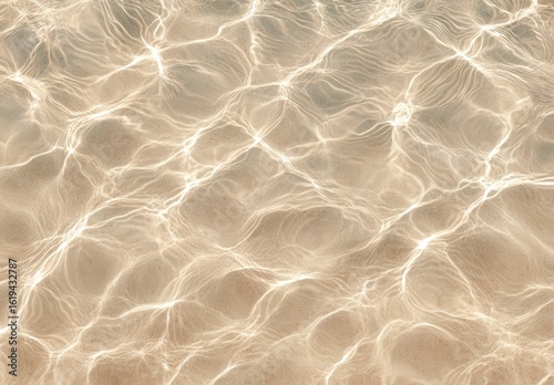 Light reflecting on rippled, beige water surface