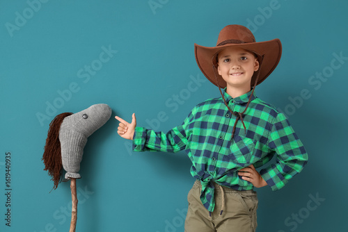 Cute little cowboy pointing...