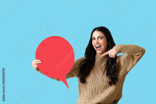 Young woman pointing at bla...