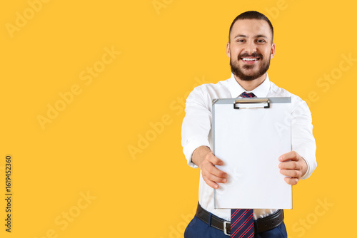 Young businessman with blan...