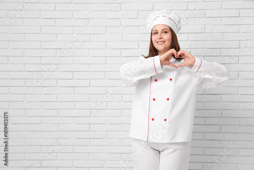 Young female chef making he...